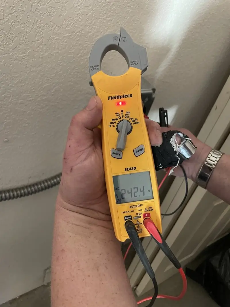 Voltage testing with clamp meter during Generator Installation in Taylor